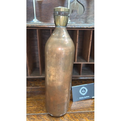 65 - Hand-made cylindrical brass bottle, rounded shoulders, threaded neck and screw cap, interior unlined... 