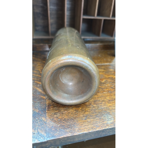 65 - Hand-made cylindrical brass bottle, rounded shoulders, threaded neck and screw cap, interior unlined... 