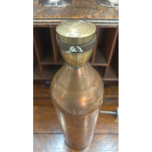 65 - Hand-made cylindrical brass bottle, rounded shoulders, threaded neck and screw cap, interior unlined... 