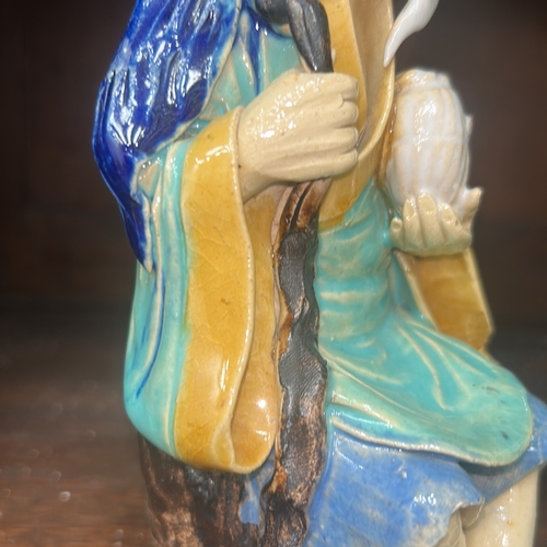 50 - Pair of Chinese Shiwan style glazed earthenware ‘mudman’ figures, each depicting a sage with staff a... 