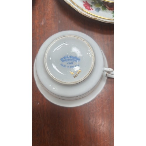 17 - Grosvenor China “ye Old English” bone china tea cups and serving plates.