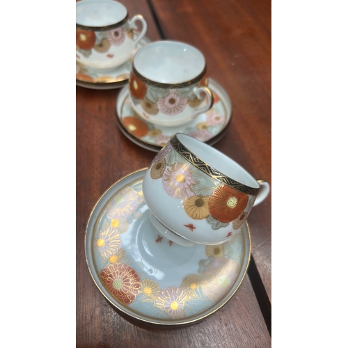 19 - Early 20th-century Kutani-style porcelain coffee service, hand-enameled with gilt chrysanthemum band... 