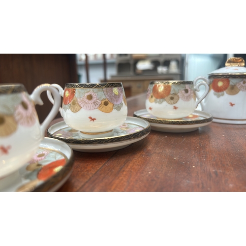 19 - Early 20th-century Kutani-style porcelain coffee service, hand-enameled with gilt chrysanthemum band... 