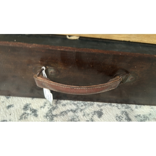14 - Long wooden carrying case with leather handle and twin metal latches, interior black-painted; early ... 