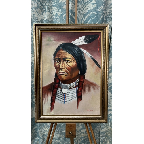 43 - Oil on board portrait of a Native American chief with braided hair and feather, signed lower right “... 