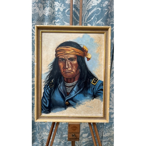 44 - Signed A.R. Overy, oil on canvas portrait of a Native American warrior wearing a bead necklace, ochr... 