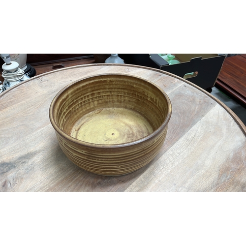 40 - Wheel-thrown stoneware bowl with ochre and brown banded glaze, paper label for Nottinghamshire Craft... 