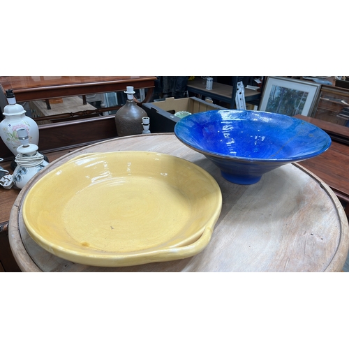 41 - Pair of contemporary hand-thrown glazed ceramic bowls comprising a shallow ochre earthenware dish wi... 