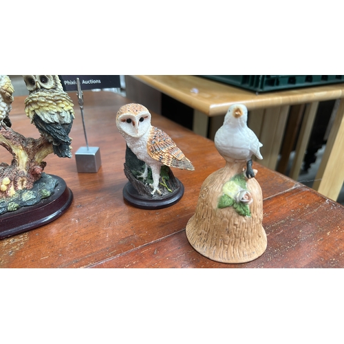 35 - Group of six small bird sculptures—owls, songbirds, and gull—modelled in painted ceramic and resin o... 