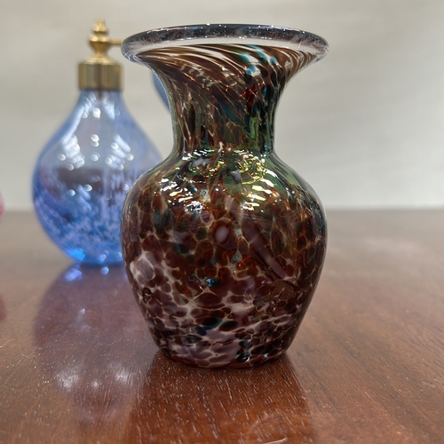 36 - Group of four hand-blown studio art glass pieces: clear ice-textured votive, pink spiral miniature v... 