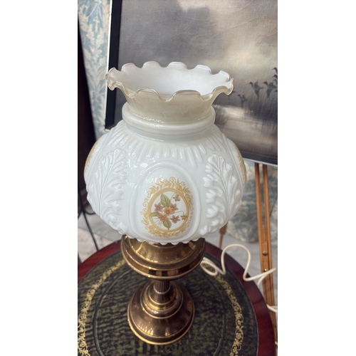 23 - Electrified brass table lamp with baluster oil font and fluted column, fitted with moulded milk glas... 