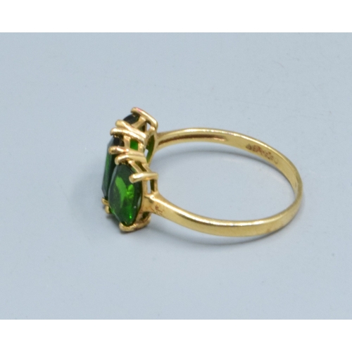 3 - 9ct gold ladies 3 stone Grossular Garnet ring the head being 14mm wide the height being 7mm tall in ... 