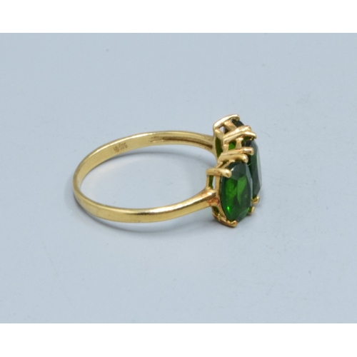 3 - 9ct gold ladies 3 stone Grossular Garnet ring the head being 14mm wide the height being 7mm tall in ... 