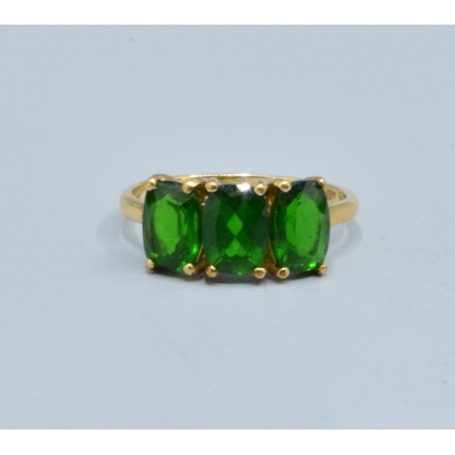 3 - 9ct gold ladies 3 stone Grossular Garnet ring the head being 14mm wide the height being 7mm tall in ... 