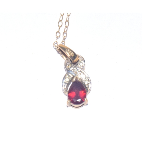 24 - 9ct gold Diamond and red gem stone pendant necklace on a 9ct gold chain of 40cm
