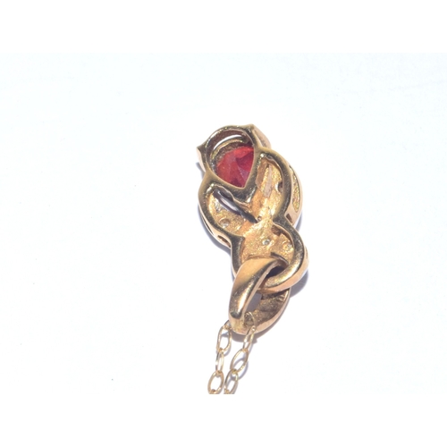 24 - 9ct gold Diamond and red gem stone pendant necklace on a 9ct gold chain of 40cm