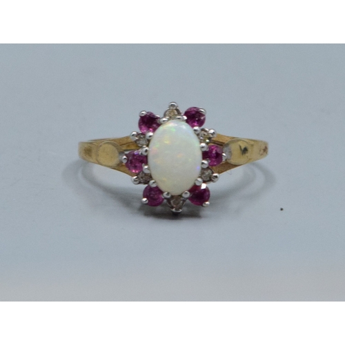 30 - 9ct gold ladies vintage Opal and garnet with Diamond decoration cluster ring the head being 10mm dia... 