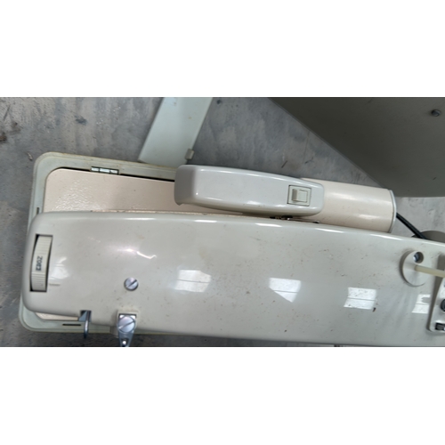 Panoramic portable electric sewing machine with integral hard plastic