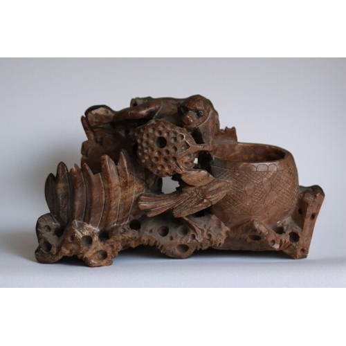 284 - A Chinese carved soapstone figure of a Sow and piglets. On wooden base. 1st half 20th century. Toget... 