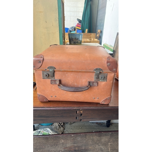 335 - Rectangular tan leather suitcase with stitched edges, riveted corner protectors, twin brass locks, a... 