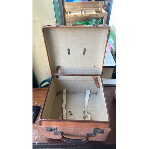 335 - Rectangular tan leather suitcase with stitched edges, riveted corner protectors, twin brass locks, a... 