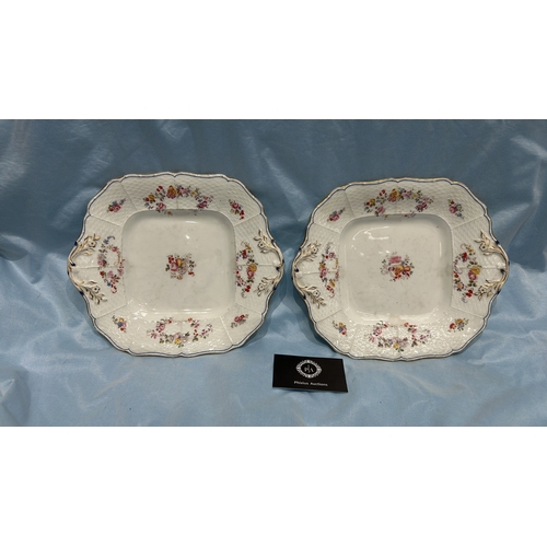79 - Pair of English porcelain square serving plates, moulded basketweave panels hand-painted with polych... 