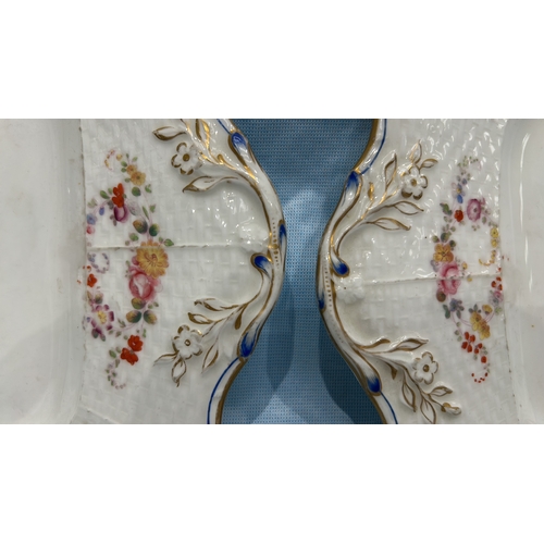 79 - Pair of English porcelain square serving plates, moulded basketweave panels hand-painted with polych... 