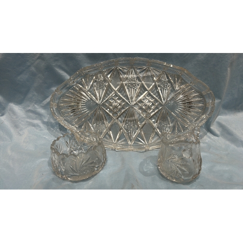 81 - Three-piece pressed glass serving set, comprising an oval diamond-cut tray, scalloped circular bowl ... 