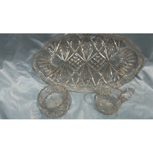 81 - Three-piece pressed glass serving set, comprising an oval diamond-cut tray, scalloped circular bowl ... 