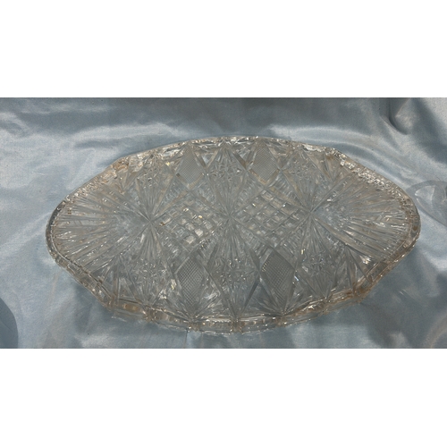 81 - Three-piece pressed glass serving set, comprising an oval diamond-cut tray, scalloped circular bowl ... 