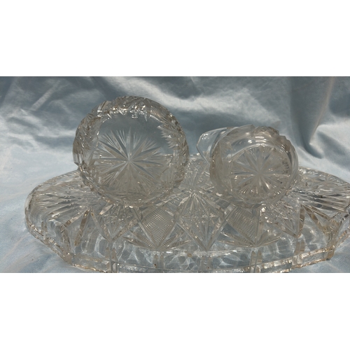 81 - Three-piece pressed glass serving set, comprising an oval diamond-cut tray, scalloped circular bowl ... 