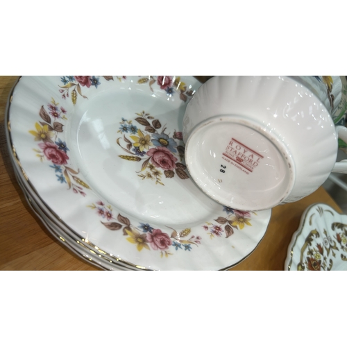 100 - Group of assorted English bone china cups, saucers and side plates by Royal Stafford and Portmeirion... 