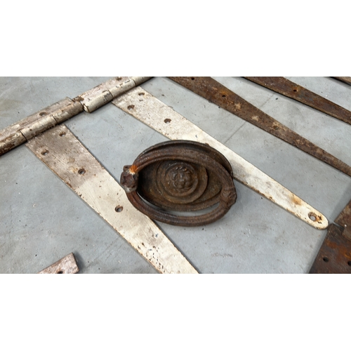 104 - Group of reclaimed wrought iron T-strap and butt hinges in assorted lengths, together with an oval c... 
