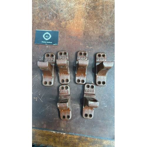 105 - Set of 6 brown-painted cast iron bed-rail angle brackets, each embossed 