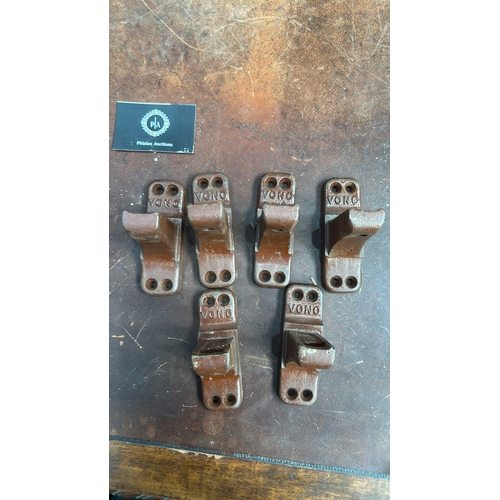 105 - Set of 6 brown-painted cast iron bed-rail angle brackets, each embossed 