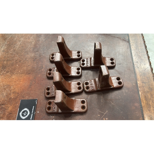105 - Set of 6 brown-painted cast iron bed-rail angle brackets, each embossed 