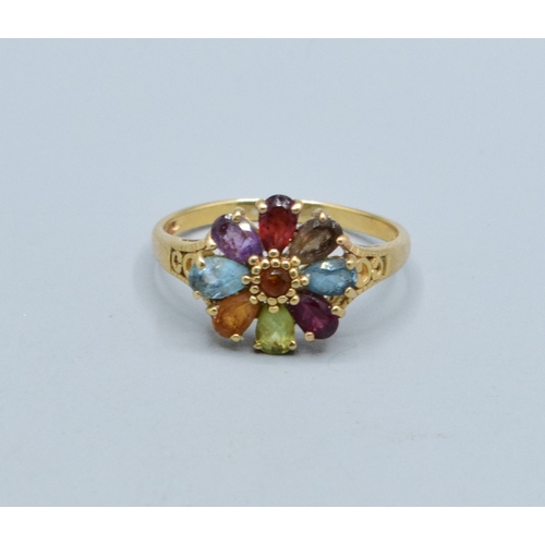 44 - Ladies multi gem set flower head ring in 9ct gold with Amethyst Peridot Garnet Ruby Aquamarine and T... 
