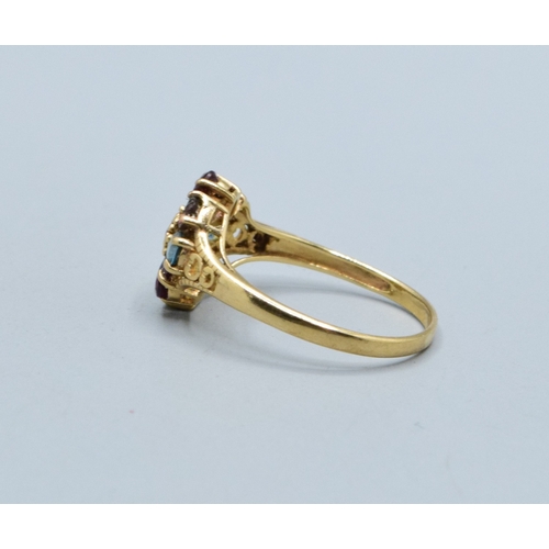 44 - Ladies multi gem set flower head ring in 9ct gold with Amethyst Peridot Garnet Ruby Aquamarine and T... 