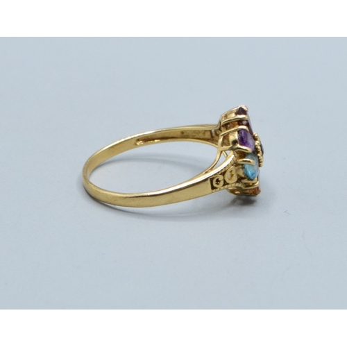 44 - Ladies multi gem set flower head ring in 9ct gold with Amethyst Peridot Garnet Ruby Aquamarine and T... 