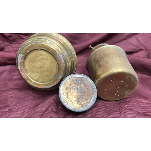 142 - Group of two brass kerosene oil lamps with pierced burners and clear glass chimneys, accompanied by ... 