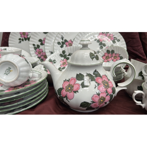 193 - Part dinner and tea service by Winterling, Bavaria, fluted white porcelain with pink wild-rose patte... 