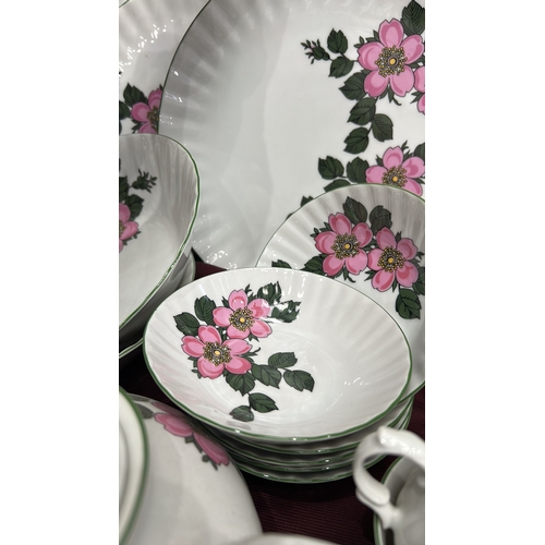 193 - Part dinner and tea service by Winterling, Bavaria, fluted white porcelain with pink wild-rose patte... 