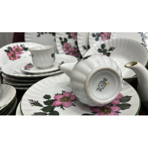 193 - Part dinner and tea service by Winterling, Bavaria, fluted white porcelain with pink wild-rose patte... 