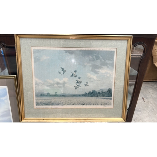 297 - Signed limited edition colour print depicting a covey of grouse in flight above stubble fields, edit... 