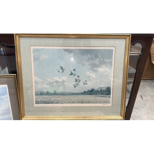 297 - Signed limited edition colour print depicting a covey of grouse in flight above stubble fields, edit... 