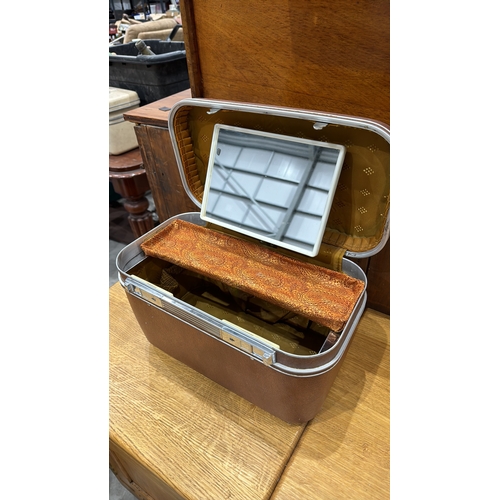 313 - Revelation hard-sided vanity case with textured brown exterior, chrome trim, hinged lid containing r... 