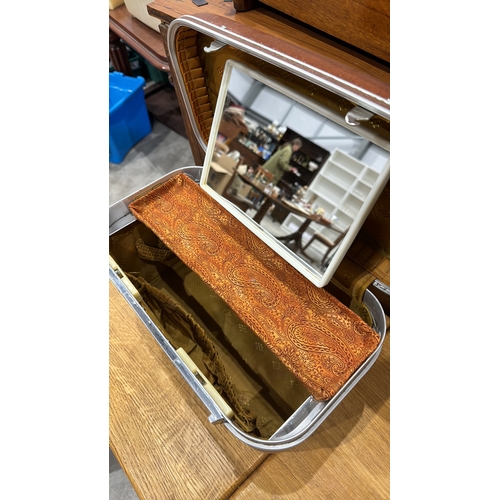 313 - Revelation hard-sided vanity case with textured brown exterior, chrome trim, hinged lid containing r... 