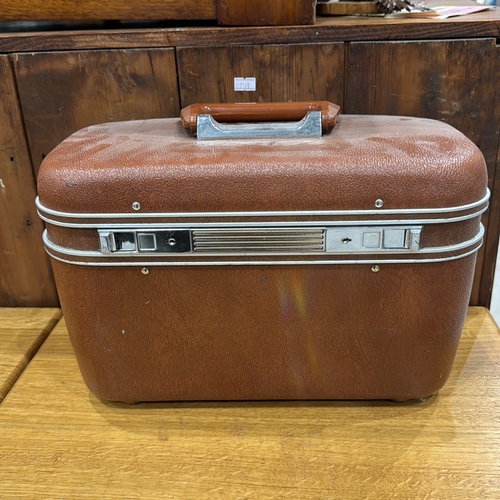 313 - Revelation hard-sided vanity case with textured brown exterior, chrome trim, hinged lid containing r... 