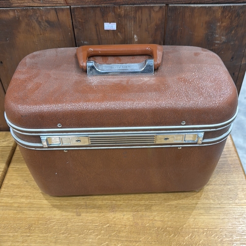 313 - Revelation hard-sided vanity case with textured brown exterior, chrome trim, hinged lid containing r... 
