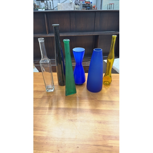 324 - Set of six decorative blown and moulded glass vases/bottles in cobalt, emerald, amber, clear and obs... 